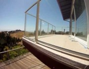 Finished Hillside Duradek and Glass Railing